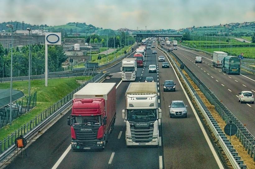 The photo shows vehicles on the highway