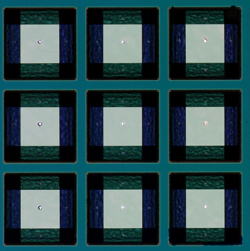 A sample extract. The white dots in the middle of the light squares are holes formed after treating the layer with an X-ray pulse.