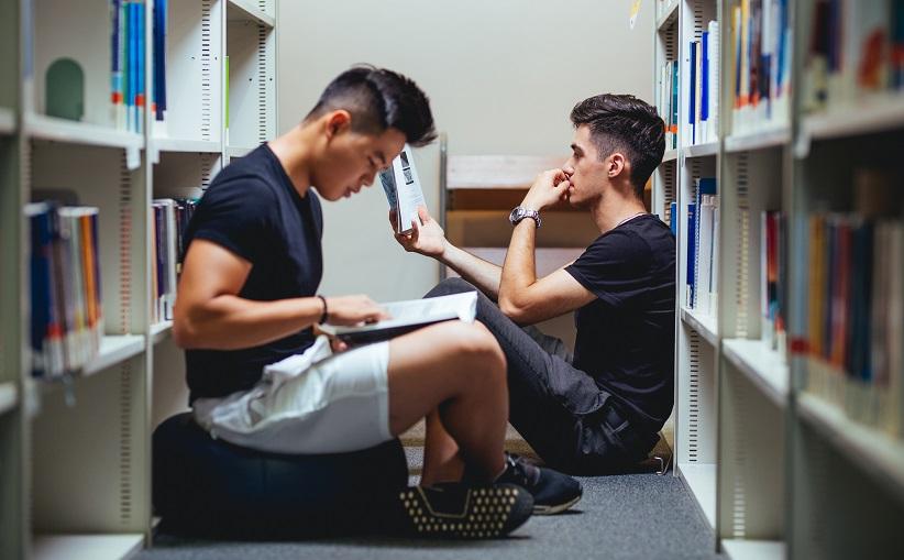 The picture shows students in a library.